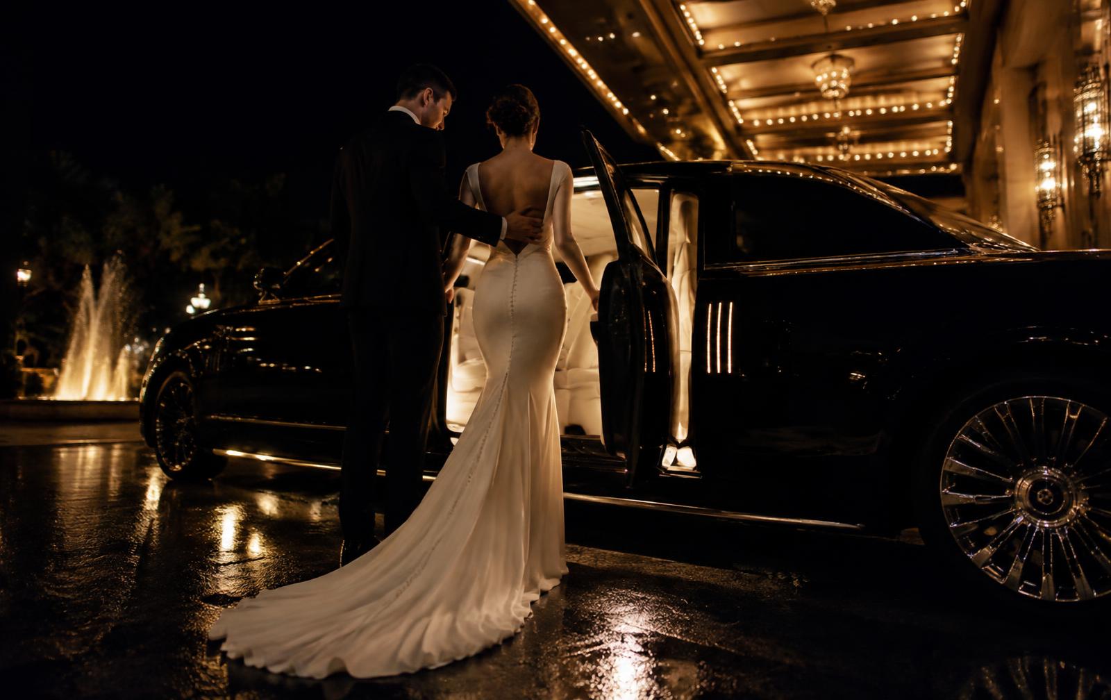 Wedding limo service St. Paul couple entering stretch limousine